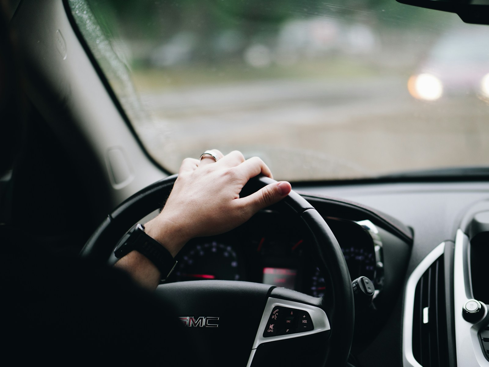 person driving GMC vehicle, auto