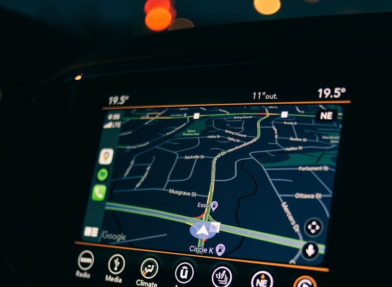 a car dashboard with a gps device in the middle of it